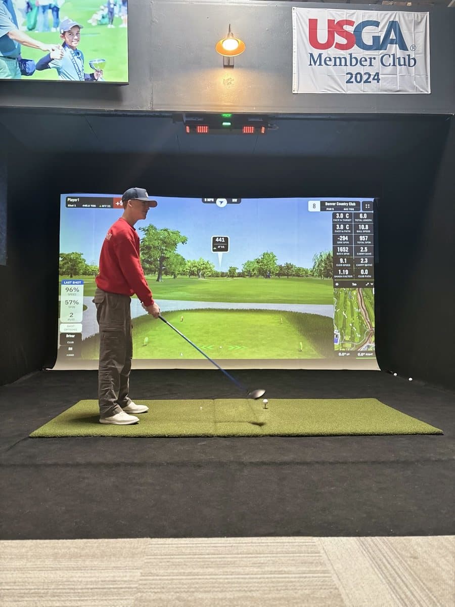 A teenage competitor hitting driver during a tournament round